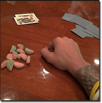 Justin Bieber playing poker with sour patch worms